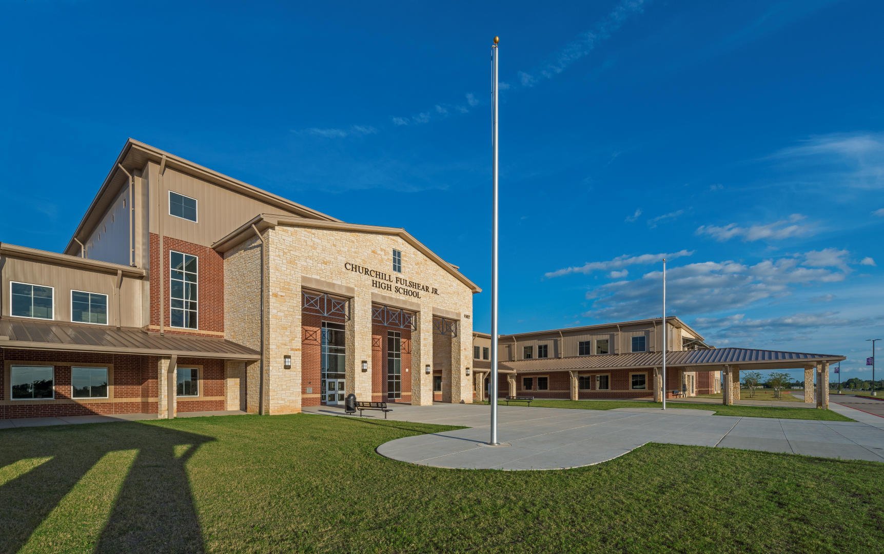 Lamar Consolidated ISD – Churchill Fulshear Jr. - High School & Dean Leaman Junior High SchoolThe Lamar CISD Churchill Fulshear High School and Dean Leaman Junior High School educational complex encompasses a 166 acre site. The approximately 590,000 SF of structures are comprised of a two-story high school, two-story junior high school, a single story athletic field house, single story transportation building, concession stands and ticket booths. Other elements include a competition football field, running track and field events, several football/soccer practice fields, baseball field, softball field, tennis courts, detention pond and extensive concrete paving. All structures are covered with standing seam metal roofing and include striking architectural features such as natural stone accents and expansive main street corridors. Back to Portfolio